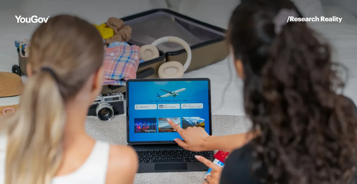 Women booking holiday on laptop