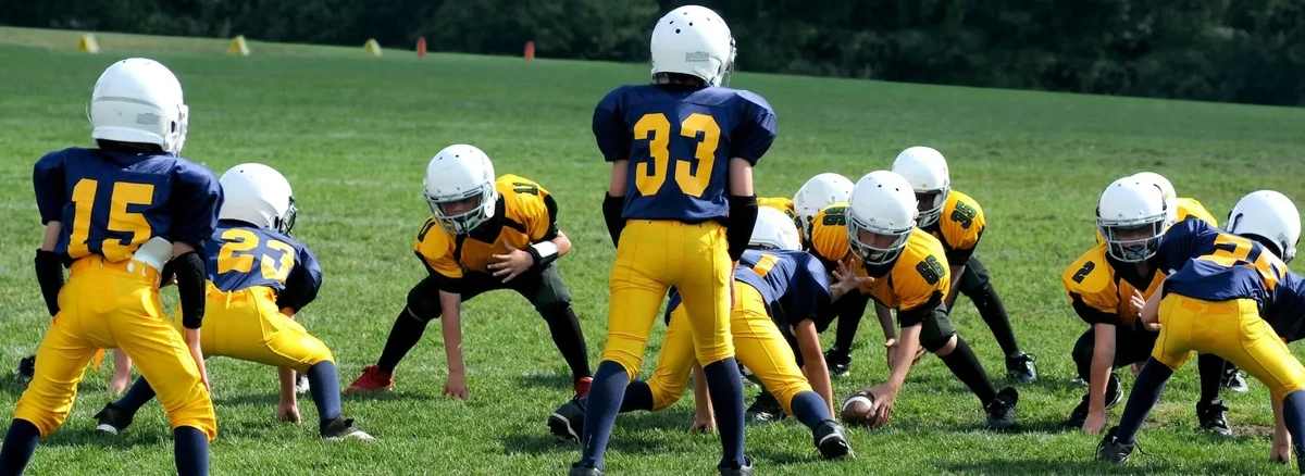 Kids playing American football