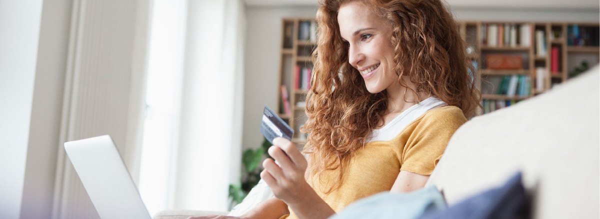 woman holding credit card