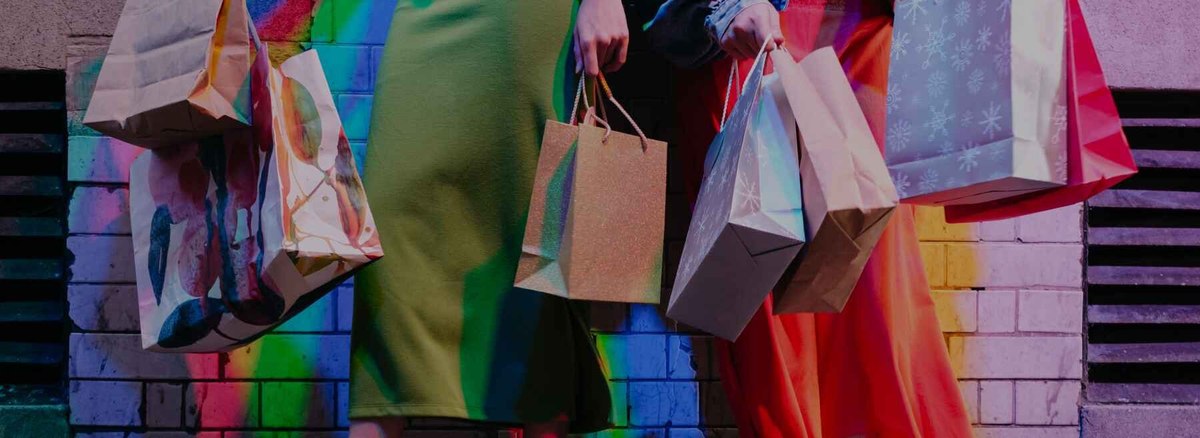 people with shopping bags image