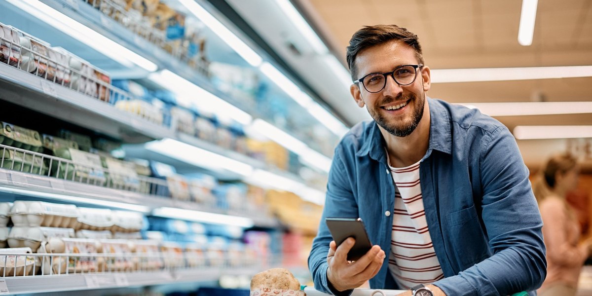 Man in supermarket aisle