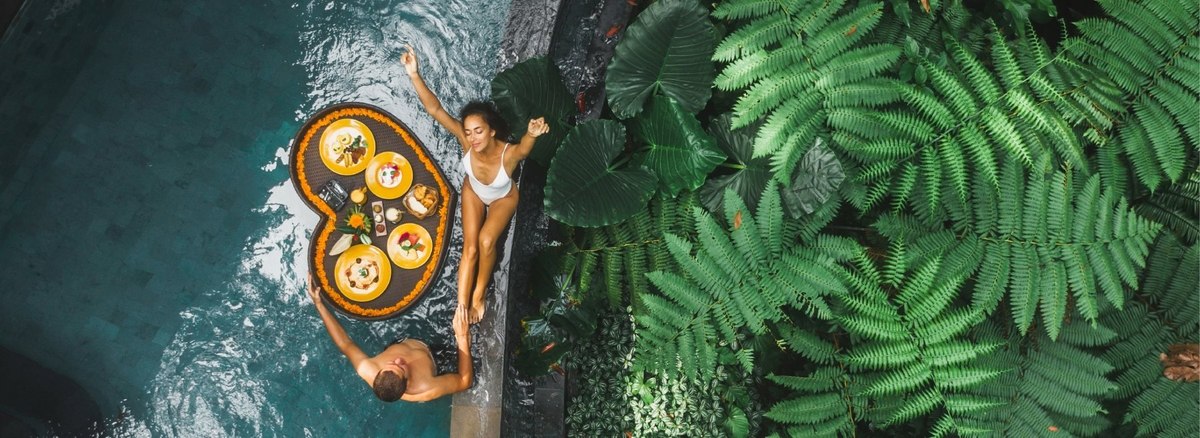 people having breakfast in a pool image