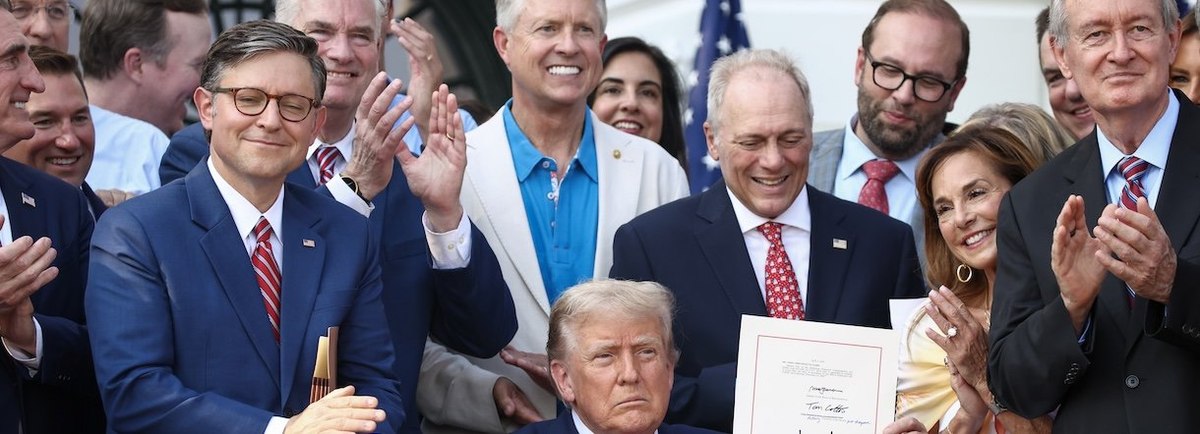 WASHINGTON, DC - JULY 04: U.S. President Donald Trump, joined by Republican lawmakers, signs the One, Big Beautiful Bill Act into law during an Independence Day military family picnic on the South Lawn of the White House on July 04, 2025 in Washington, DC