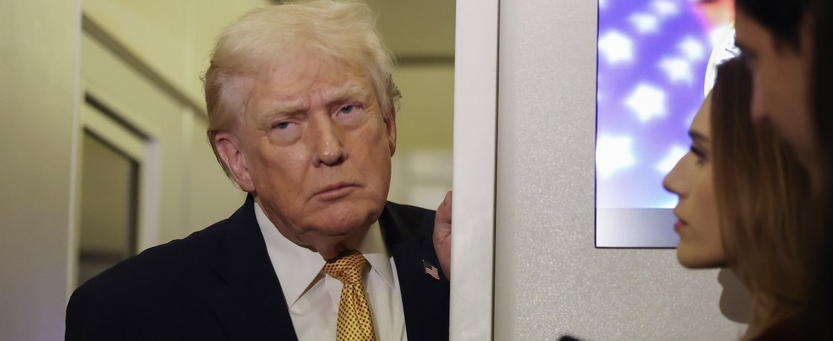 IN FLIGHT - JANUARY 04: President Donald Trump speaks to the media aboard Air Force One en route to Washington, DC on January 04, 2026. Trump is returning to the White House after giving the order for the United States law enforcement to capture Venezuela