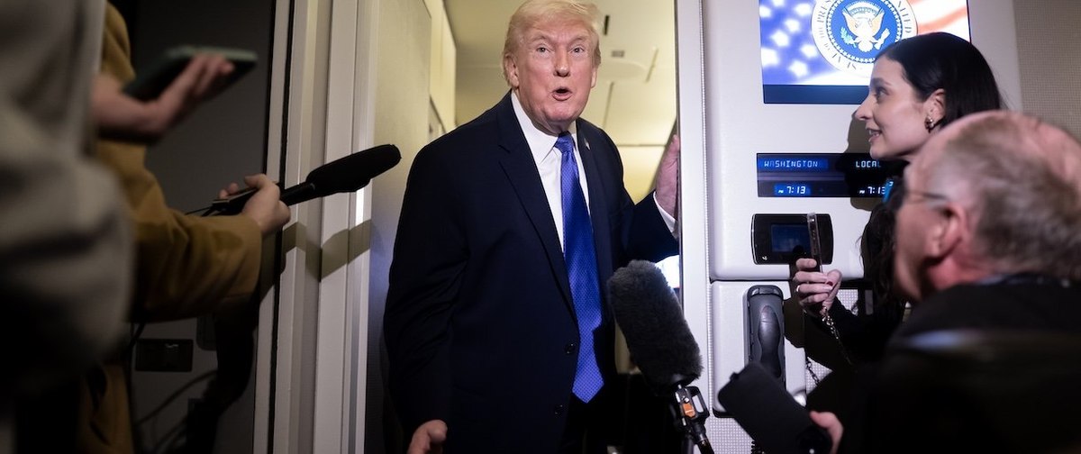 IN FLIGHT - FEBRUARY 16: President Donald Trump speaks to members of the media aboard Air Force One while flying from Palm Beach International Airport on February 16, 2026 en route to Washington, DC. President Trump returned to Washington after a Presidents Day weekend in Florida. (Photo by Nathan Howard/Getty Images)