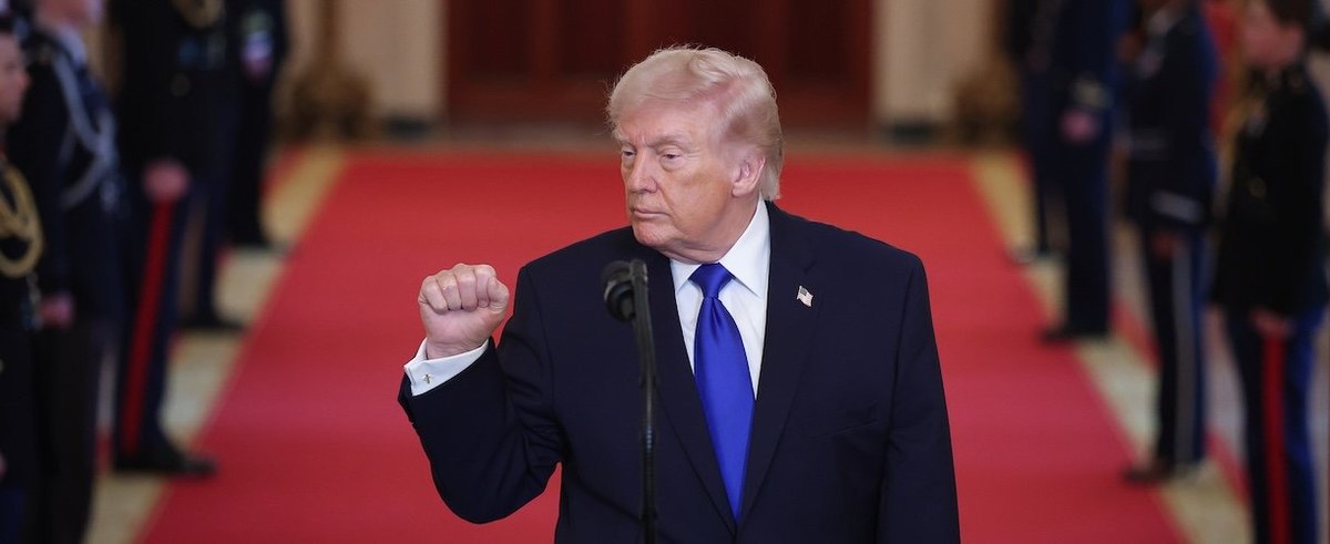 WASHINGTON, DC - FEBRUARY 23: U.S. President Donald Trump pumps his fist after speaking at an Angel Families remembrance ceremony held in the East Room at the White House February 23, 2026 in Washington, DC. The term “Angel Families” is used to describe people who have lost a relative to a crime committed by an undocumented immigrant. (Photo by Win McNamee/Getty Images)