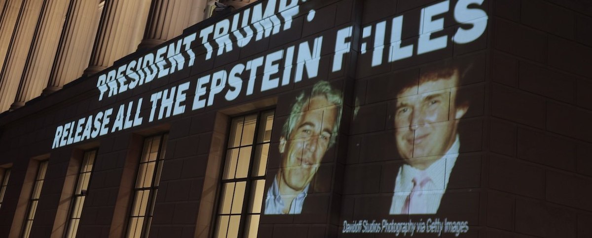 WASHINGTON, DC - JULY 18: An image of U.S. President Donald Trump and Jeffrey Epstein, along with the words “President Trump: Release All the Epstein Files”, is projected onto the U.S. Chamber of Commerce building on July 18, 2025, in Washington, D.C. Ear