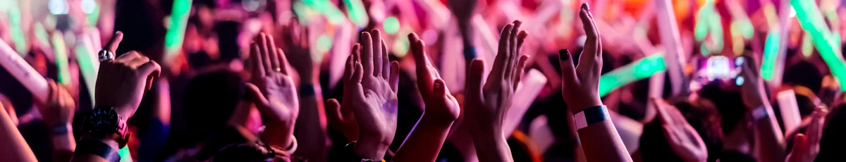 Hands at a neon festival