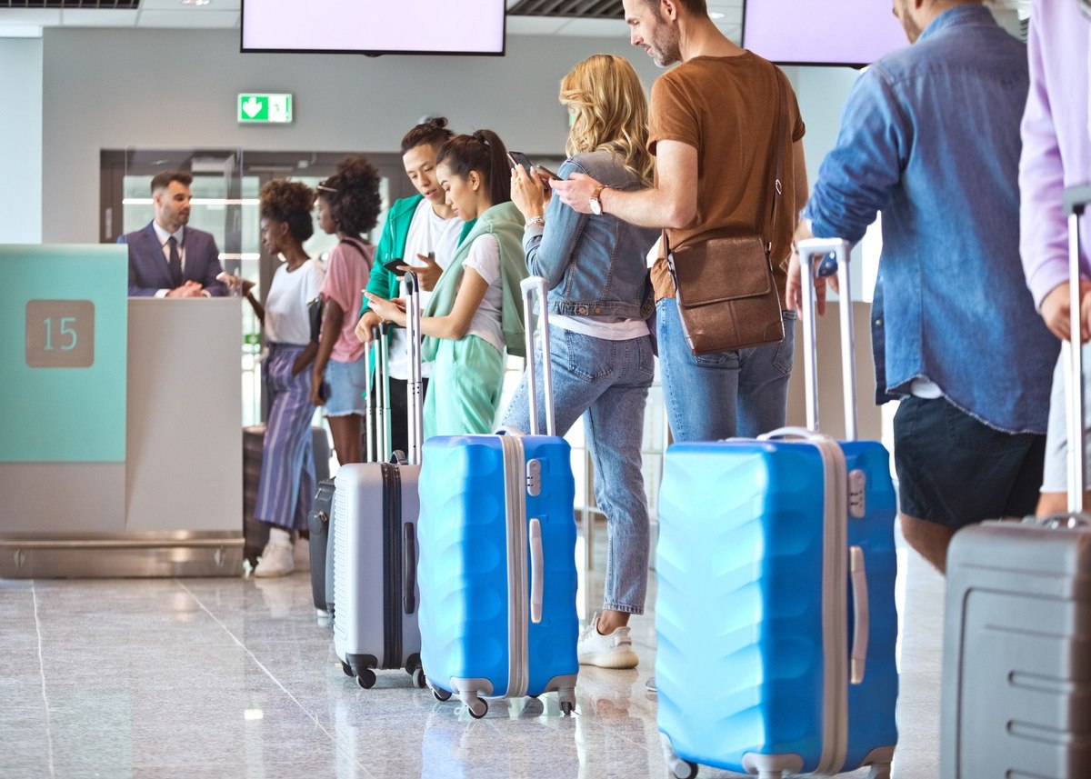 How are British travellers adapting travel plans amid fears of airport strikes and prolonged queues?