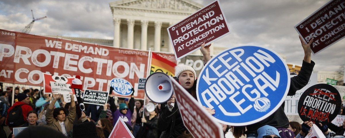 Anti-abortion and abortion rights activists protest during the 50th annual March for Life rally in front of the U.S. Supreme Court on January 20, 2023 in Washington, DC.