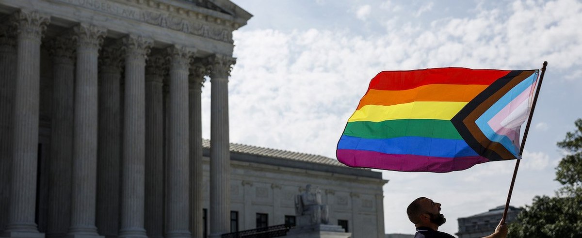 Same-sex marriage supporter Vin Testa, of Washington, DC, waves a LGBTQIA pride flag in front of the U.S. Supreme Court Building to celebrate the anniversary of the United States v. Windsor and the Obergefell v. Hodges decisions on June 26, 2023.