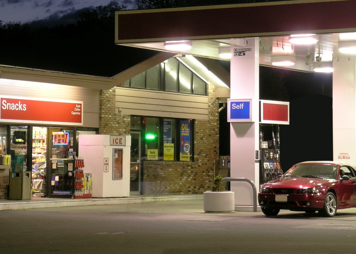 What do US consumers do at gas stations other than refuel their cars?