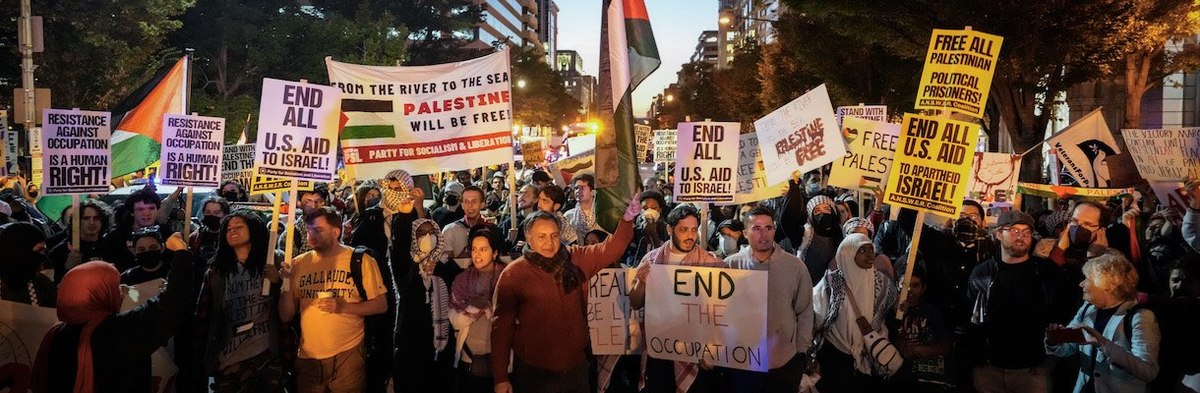 WASHINGTON, DC - OCTOBER 13: Hundreds of protestors block traffic on K Street as they rally in support of Palestinians in the Gaza Strip, in downtown Washington, DC October 13, 2023.