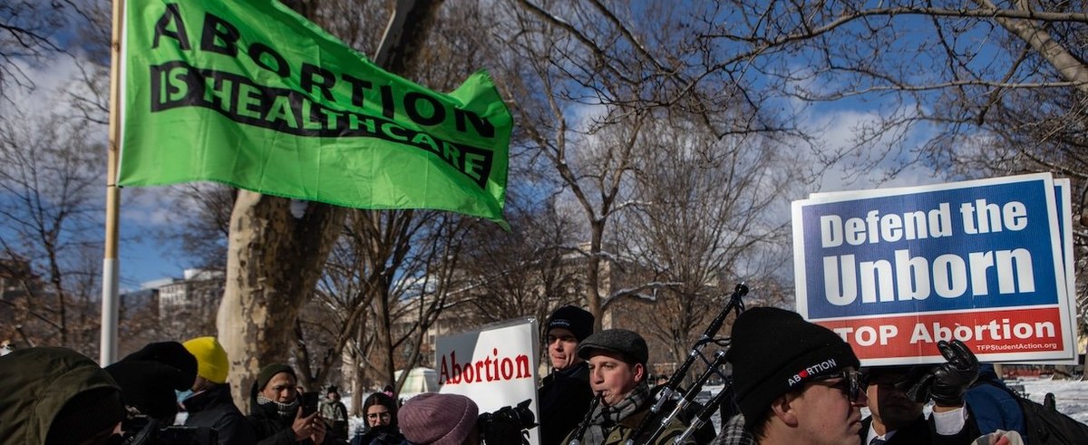 Pro and anti-abortion demonstrators clash during the Annual Women's March to the White House to mark the anniversary of the 1973 passage of Roe v. Wade on January 20, 2024 in Washington, DC.
