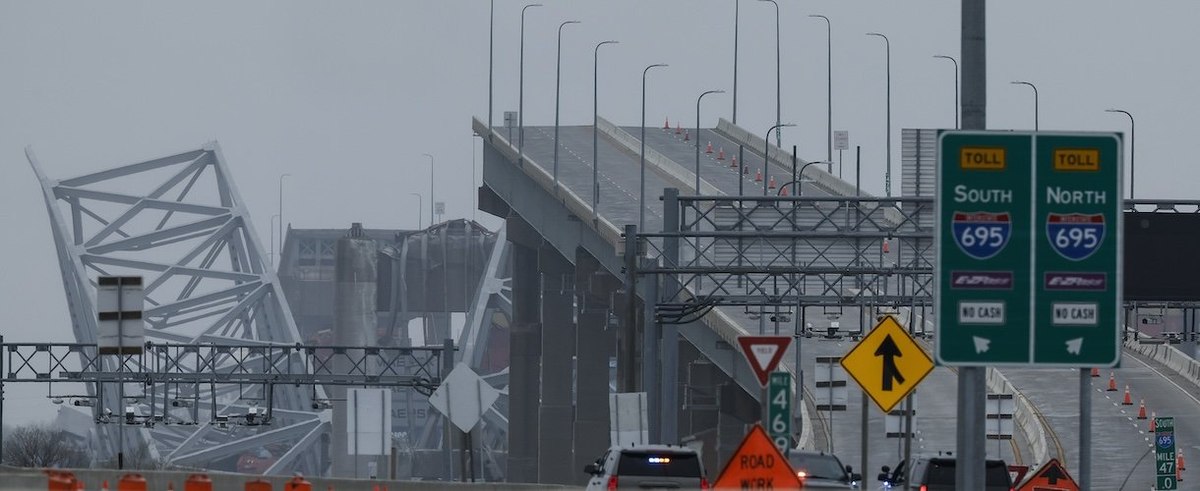 The collapsed Francis Scott Key Bridge is seen in the background of the on ramp to the bridge on March 27, 2024 in Baltimore, Maryland.