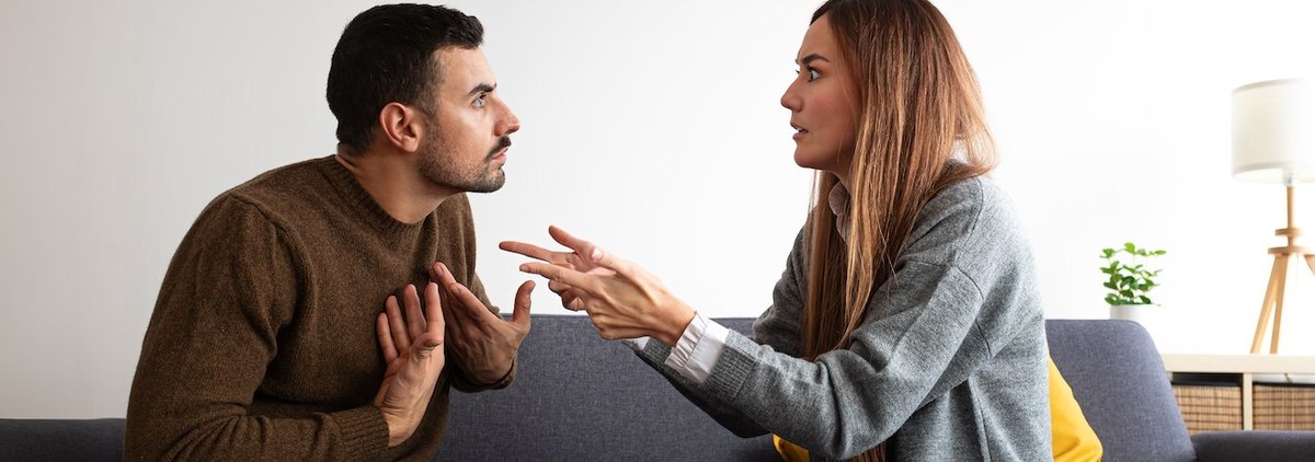 Young couple having an argument. Woman is angry with man.