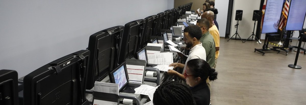 TAMPA, FLORIDA - OCTOBER 3: The Supervisor and Elections office staff run test ballots through the voting machines during a test run at the Supervisor of Elections Office in Tampa, Florida, on October 3, 2024. The canvassing board conducts a public test o