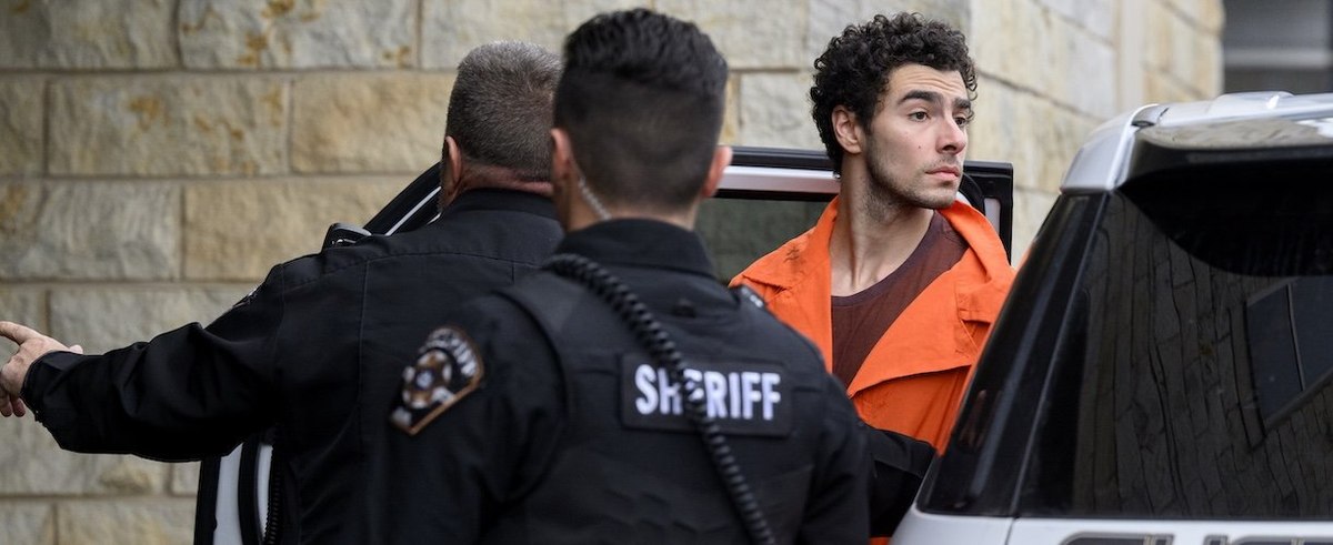 Suspected shooter Luigi Mangione is led into the Blair County Courthouse for an extradition hearing December 10, 2024 in Hollidaysburg, Pennsylvania.