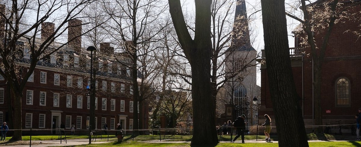 CAMBRIDGE, MASSACHUSETTS - APRIL 17: People walk through campus at Harvard University on April 17, 2025 in Cambridge, Massachusetts. The Trump administration announced that it would block Harvard University from receiving $2.2 billion in federal grants an