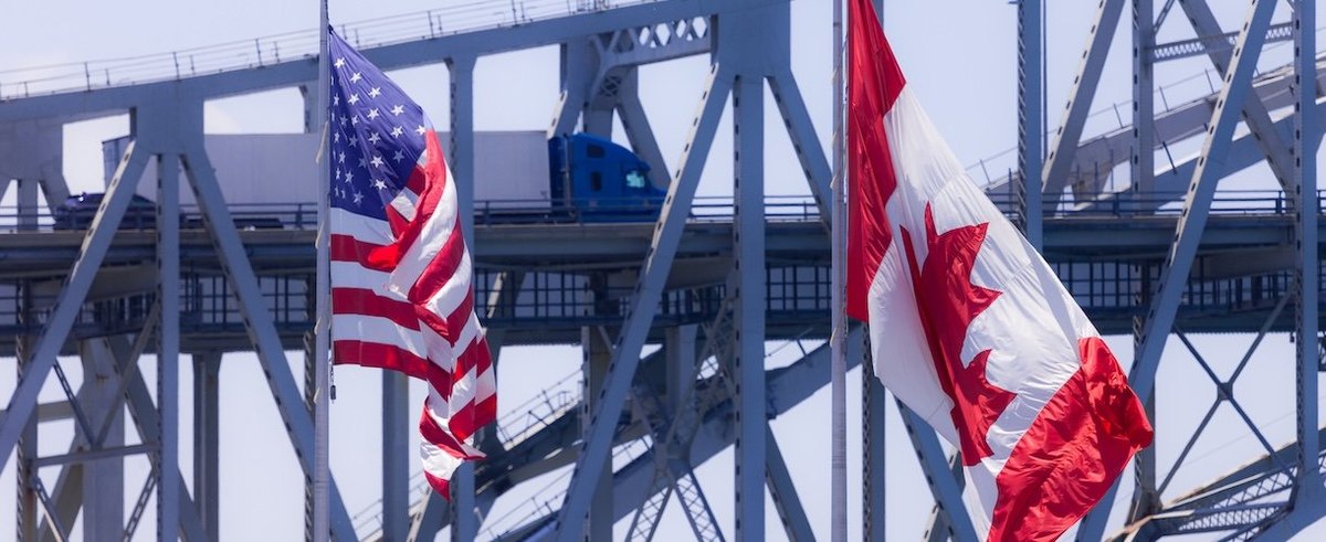 Sarnia, Canada - June 11, 2017. Trucks and cars make their way across the Blue Water Bridge in Sarnia Canada. Opened in 1938 the bridge connects Canada to the United States.