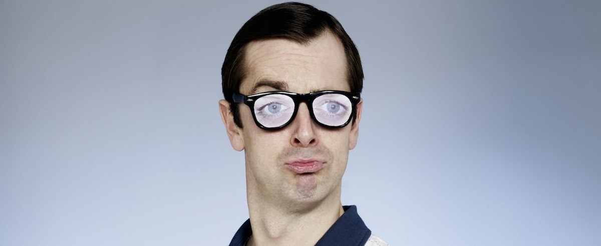 Portrait of man wearing novelty glasses - stock photo