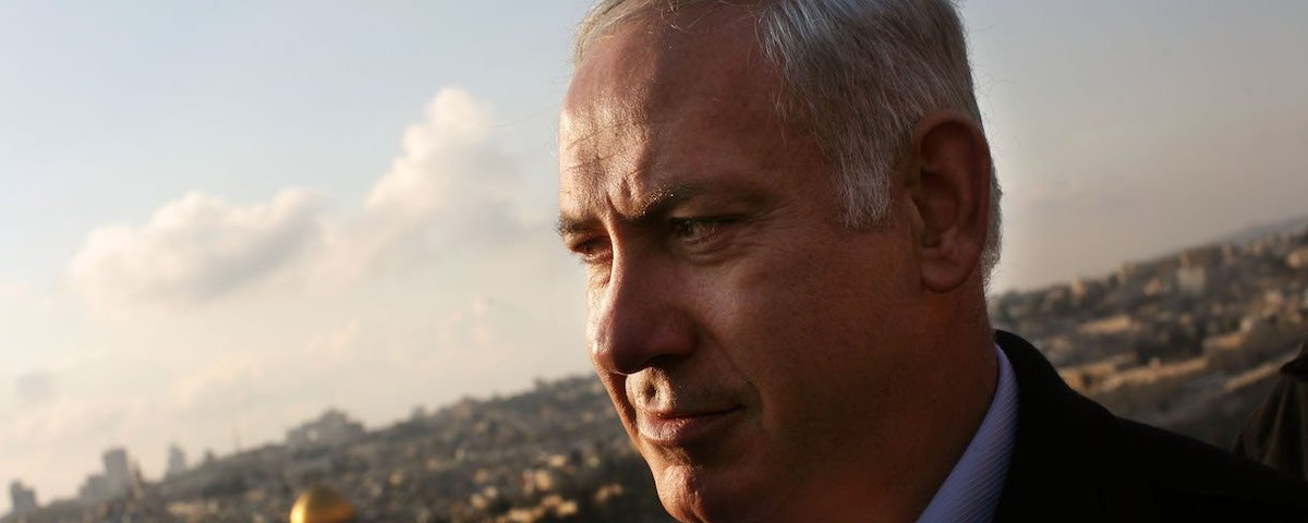 Benjamin Netanyahu looks on during a campaign tour, with the Dome of the Rock visible in the background, February 2, 2009 in east Jerusalem, Israel