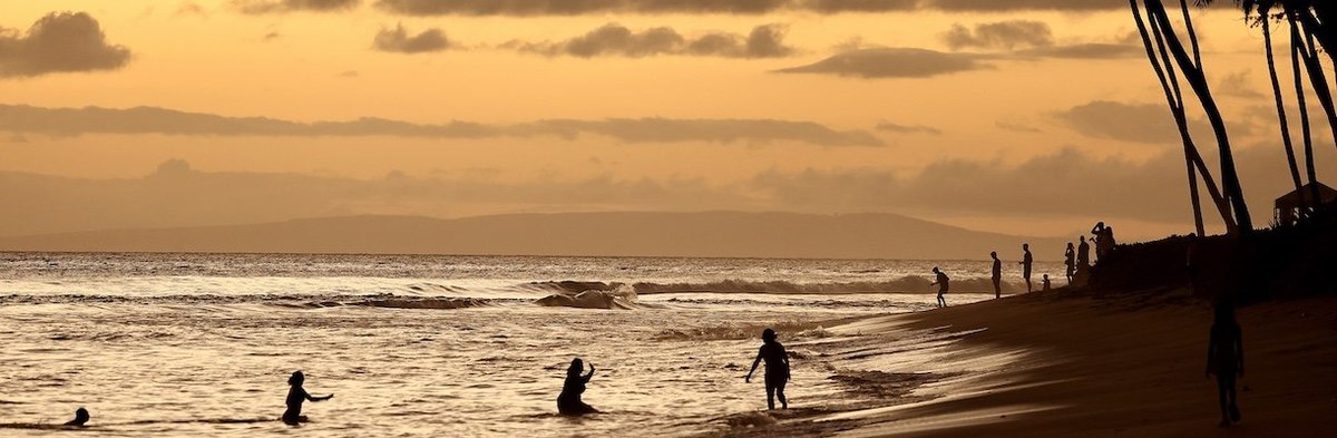 LAHAINA, HAWAII - AUGUST 04: People gather on the beach on August 4, 2024 in Lahaina, Hawaii. August 8 marks the one-year anniversary of the Maui wildfires which killed 102 people and devastated the historic community of Lahaina in West Maui. Plaintiffs i