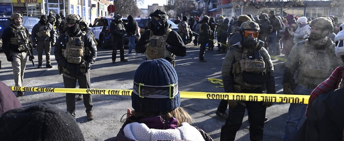 MINNEAPOLIS, MINNESOTA - JANUARY 24: Federal agents block off the scene of a shooting as crowds gather on January 24, 2026 in Minneapolis, Minnesota. Agents allegedly shot a protestor amid a scuffle to arrest him. The Trump administration has sent a reported 3,000 federal agents into the area, with more on the way, as they make a push to arrest undocumented immigrants in the region. (Photo by Stephen Maturen/Getty Images)