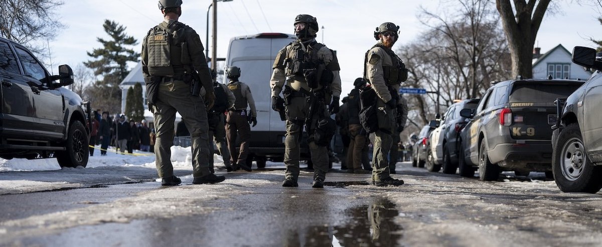 MINNEAPOLIS, MINNESOTA - JANUARY 07: Hennepin County Sheriff's officers look on as members of law enforcement hold a perimeter around the scene of a shooting by an ICE agent during federal law enforcement operations on January 07, 2026 in Minneapolis, Minnesota. According to federal officials, the agent, "fearing for his life" killed a woman during a confrontation in south Minneapolis. (Photo by Stephen Maturen/Getty Images)