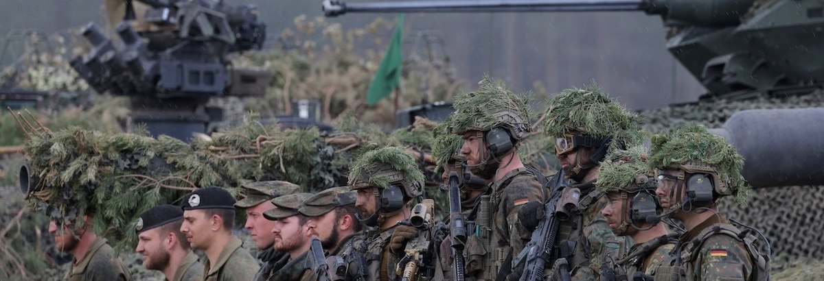 PABRADE, LITHUANIA - MAY 29: Troops of the Bundeswehr, the German armed forces, stand near their vehicles at the Quadriga military exercises involving German, French, Lithuanian and Dutch troops during a Distinguished Visitors' Day on May 29, 2024 near Pa