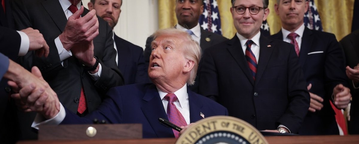 WASHINGTON, DC - JUNE 12: U.S. President Donald Trump shakes hands with lawmakers after signing a series of bills related to California’s vehicle emissions standards during an event in the East Room of the White House on June 12, 2025 in Washington, DC. M