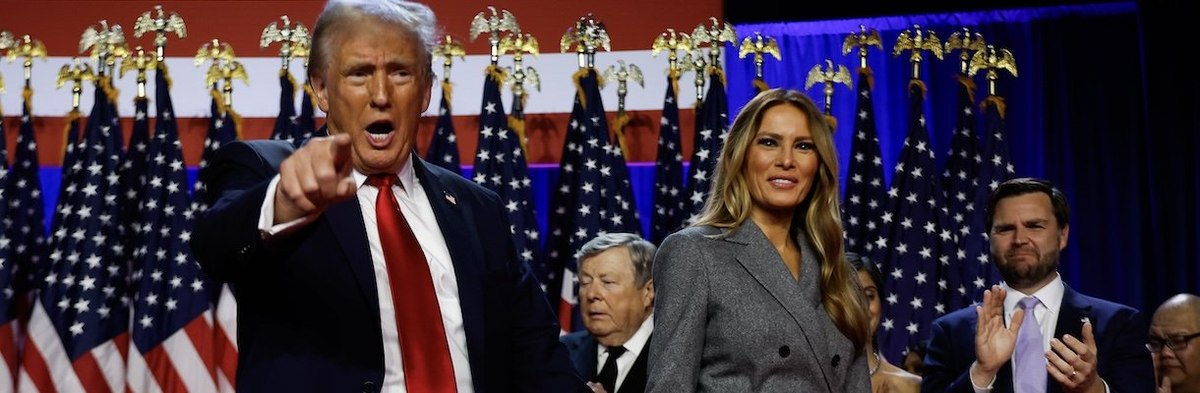 WEST PALM BEACH, FLORIDA - NOVEMBER 06: Republican presidential nominee, former U.S. President Donald Trump points to supporters with former first lady Melania Trump during an election night event at the Palm Beach Convention Center on November 06, 2024 i