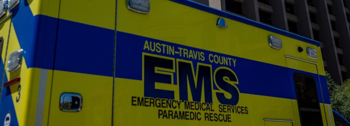 AUSTIN, TEXAS - AUGUST 08: The Texas State flag is seen blowing near an EMS ambulance on August 08, 2023 in Austin, Texas. EMT were called after the patient was found passed out and dehydrated near the Texas State Capitol. The city of Austin continues gra