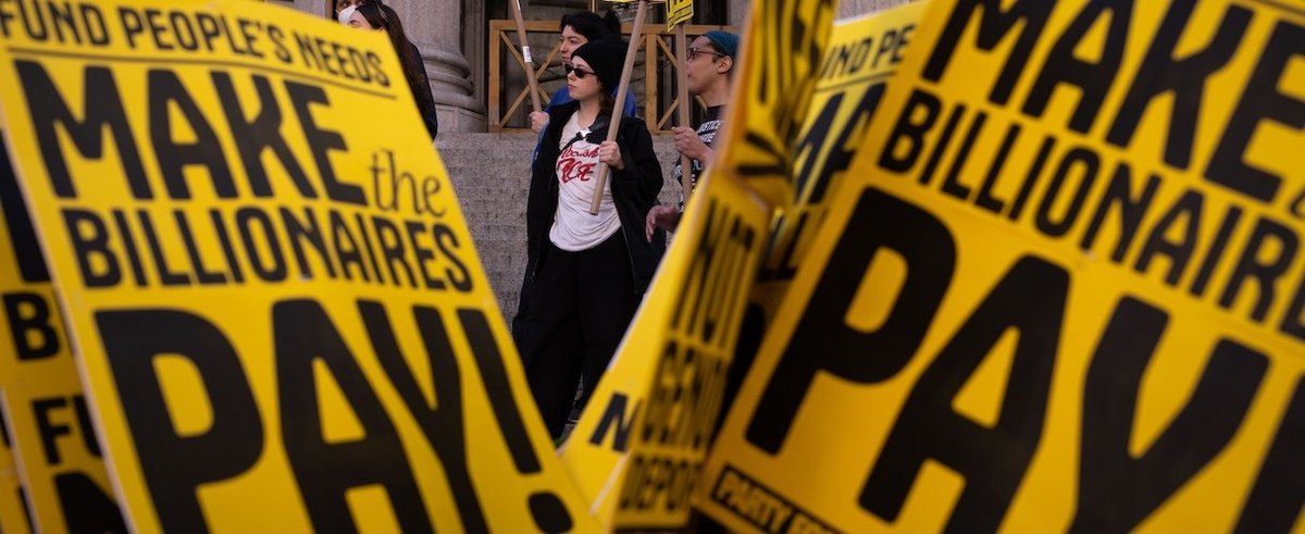 NEW YORK, NEW YORK - APRIL 15: People protest on tax day calling for billionaires to pay more tax on April 15, 2025 in New York City. Activists suggested a 90% wealth tax to guarantee universal healthcare, free college education and to eliminate hunger an