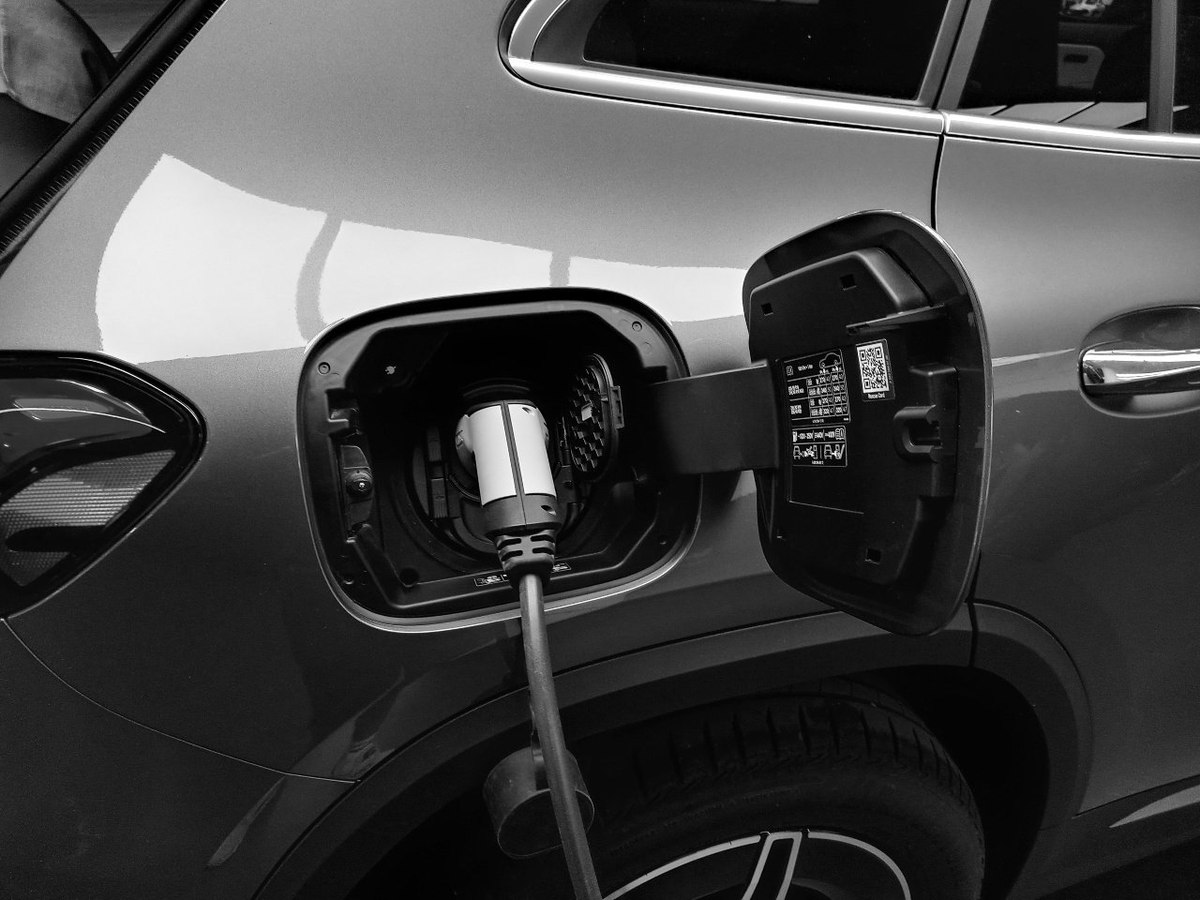 Are people willing to pay more for sustainable energy? How does their opinion differ from EV owners?