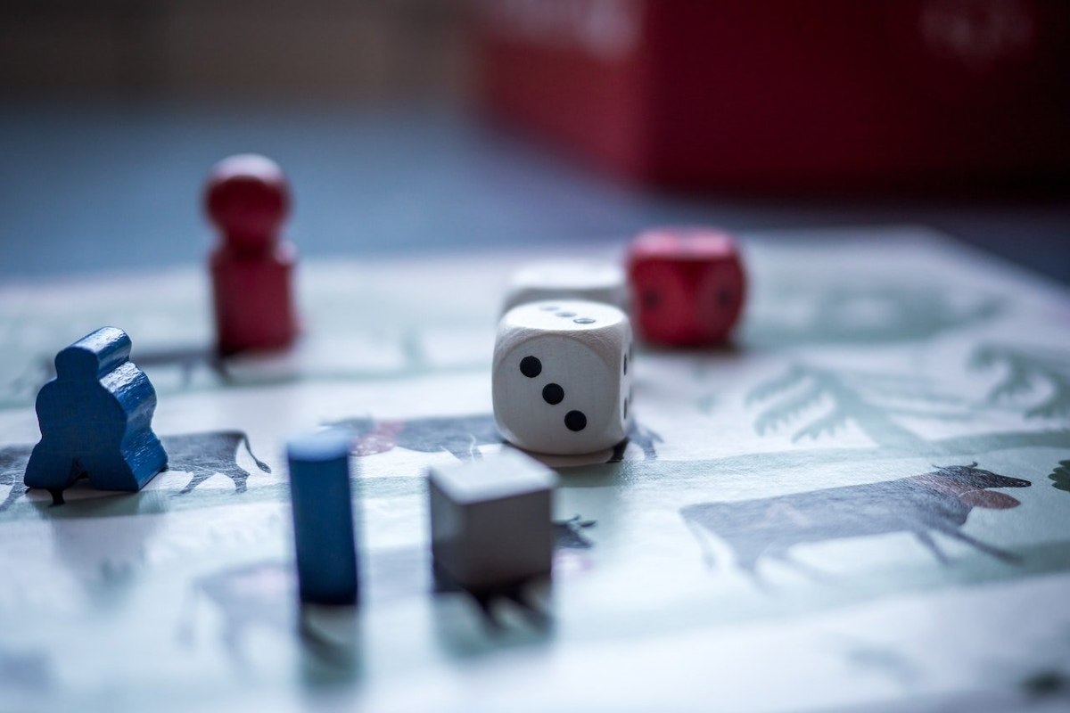 Who plays board games and what distinguishes them from video game players?