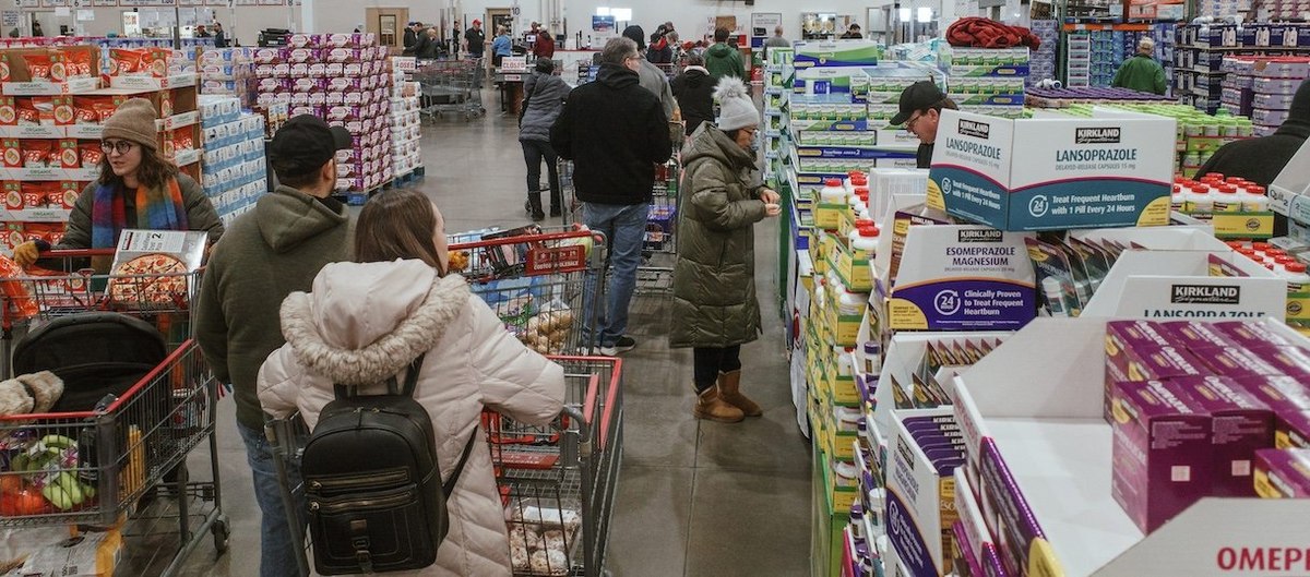 LENEXA, KANSAS - JANUARY 23: Shoppers wait in line at the cash registers at a grocery store on January 23, 2026 in Lenexa, Kansas. A massive winter storm is bringing frigid temperatures, ice, and snow to millions of Americans across the nation. (Photo by Chase Castor/Getty Images)