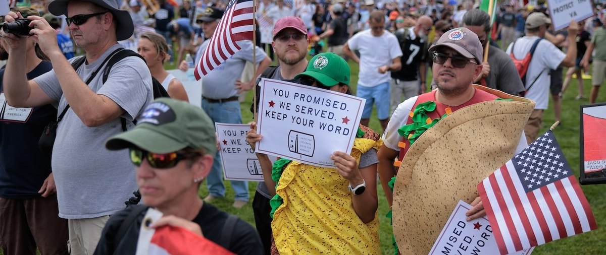 WASHINGTON, DC - JUNE 06: Veterans, active duty members of the military and their supporters gather on the National Mall during the Unite For Veterans, Unite for America Rally on June 06, 2025 in Washington, DC. Organized by the Unite For Veterans Coalition, thousands of veterans rallied against deep cuts to the Department of Veterans Affairs proposed by President Donald Trump and Veterans Affairs Secretary Doug Collins. (Photo by Chip Somodevilla/Getty Images)