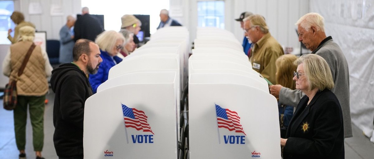 HENDERSONVILLE, NORTH CAROLINA - OCTOBER 17: Voters make selections at their voting booths inside an early voting site on October 17, 2024 in Hendersonville, North Carolina. Several counties effected by Hurricane Helene saw a large turnout of residents for the first day of early voting in Western North Carolina. (Photo by Melissa Sue Gerrits/Getty Images)