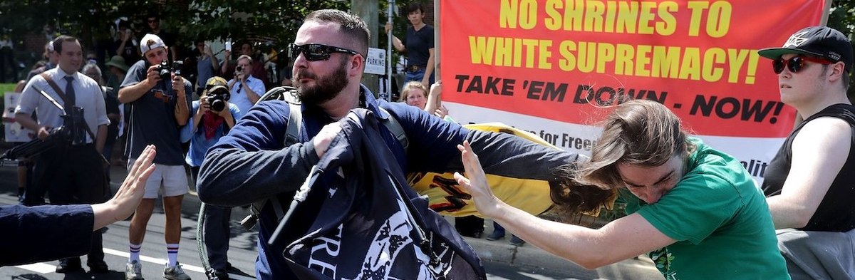 CHARLOTTESVILLE, VA - AUGUST 12: White nationalists, neo-Nazis and members of the "alt-right" clash with counter-protesters in the street after the "Unite the Right" rally was declared a unlawful gathering by Virginia State Police August 12, 2017 in Charl