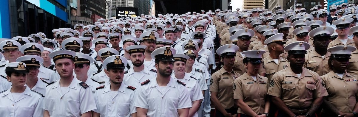 NEW YORK, NEW YORK - MAY 24: Service men and women gather in Times Square for a group photo during the start of the 35th annual Fleet Week on May 24, 2023 in New York City. Nine ships, including one each from Italy, the United Kingdom and Canada paraded i